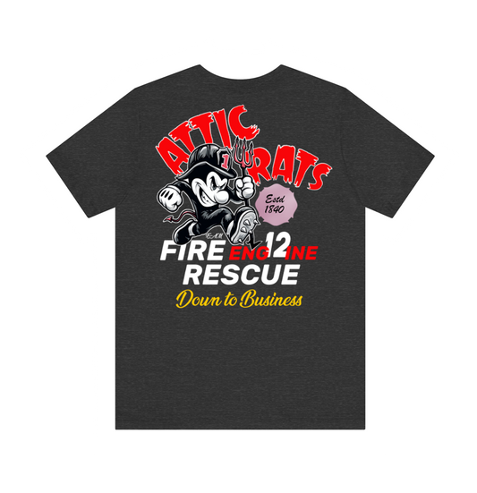 A dark heather gray t-shirt featuring a retro graphic of a cartoon fire engine mouse with the text 'ATTIC RATS', 'FIRE ENGINE RESCUE', and 'Down to Business' in red, white, and yellow.